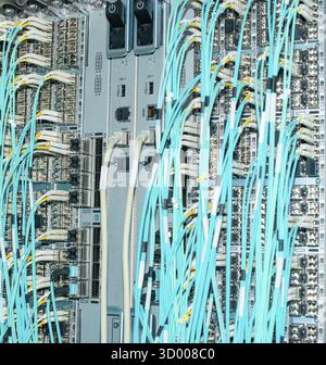 Network switch and network cable fiber optic fiber optic in a data center Network switch and network cable fiber optic fiber in a data center Stock Photo
