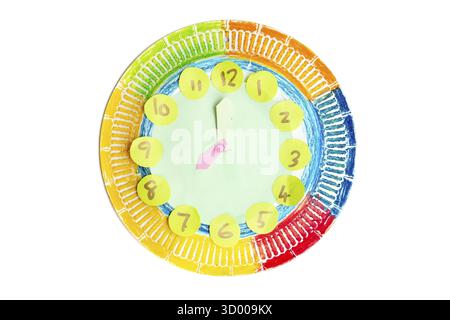 Colorful child handwork clock pointing at 8 o'clock, isolated on white background Stock Photo