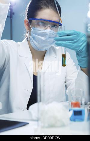Young woman carries out tests in laboratory Stock Photo