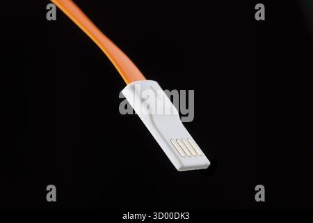 Orange connector on isolated black empty background Stock Photo