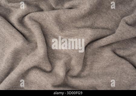 Soft grey merino wool sweater texture as a background. Top view. Stock Photo