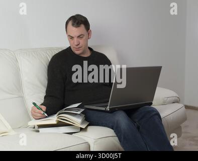 Man studying from home Stock Photo