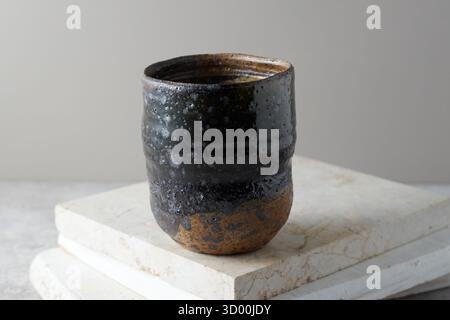 Close up ceramic cup on gray background, studio light Stock Photo