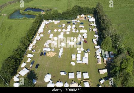 Aerial view of a tent camp and market stalls at a medieval spectacle ...