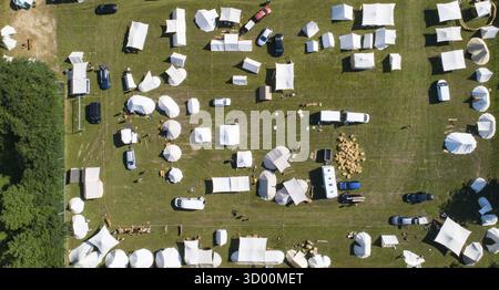 Aerial view of a tent camp and market stalls at a medieval spectacle ...