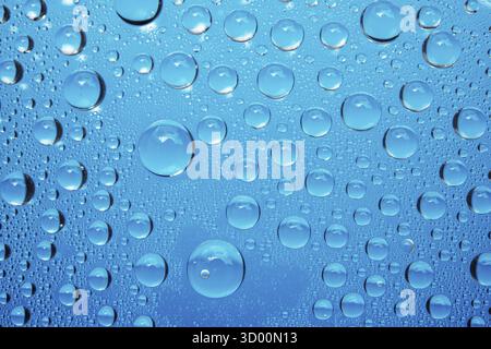 Water Drops On Blue Background Stock Photo