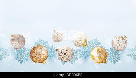 Gold and White Ornaments with Blue Snowflakes on Light Background Stock Photo