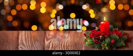 Red Christmas Candle Centerpiece on Rustic Wooden Table Stock Photo