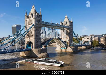 England, London, Tower Bridge with Uber Boat on River Thames Stock Photo