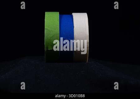 three multicoloured rolls of decorators masking tape isolated on Stock Photo