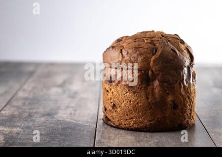 Traditional Italian Panettone on wooden table Stock Photo