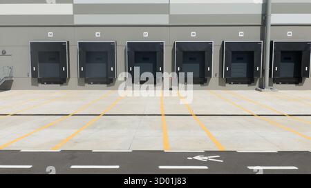 Truck dock platform logistics warehouse empty space door for loading and unloading goods. Front view. Stock Photo