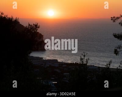 Sunset over Adriatic Sea, Peschici, Gargano Region, Puglia, Italy Stock Photo