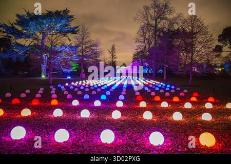 LONDON, ENGLAND - NOVEMBER 29, 2017: Pictorial view with lights projections and globes at Kew Gardens, during Christmas time. Glass filter applied. Stock Photo