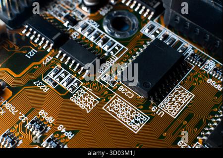 Small microprocessor, microcontroller chip on a generic modern desktop PC computer motherboard, object macro, extreme closeup, shallow dof, nobody Electrical components shortage concept, circuit board. Stock Photo