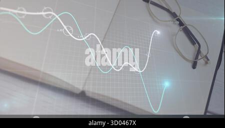 Presenting spiral-bound notebook featuring grid overlay on wooden desk, with metal-frame eyeglasses Stock Photo