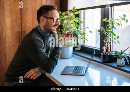 Businessman executive coach using laptop computer, having video conference call virtual meeting Stock Photo