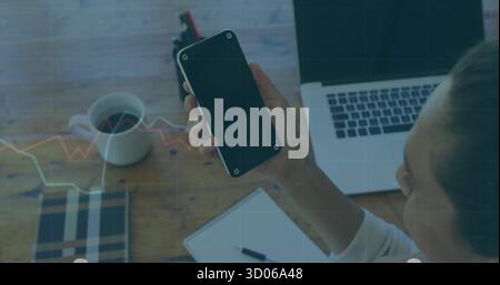 Scrolling smartphone screen, woman in white shirt at office desk, laptop and coffee mug, copy space Stock Photo