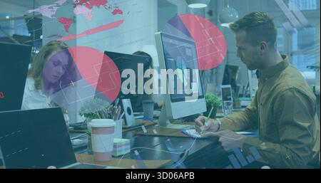 Man in brown button-down shirt writing notes at office desk, with laptop coffee cup, copy space Stock Photo