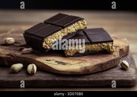 Dark chocolate squares with pistachio filling Stock Photo