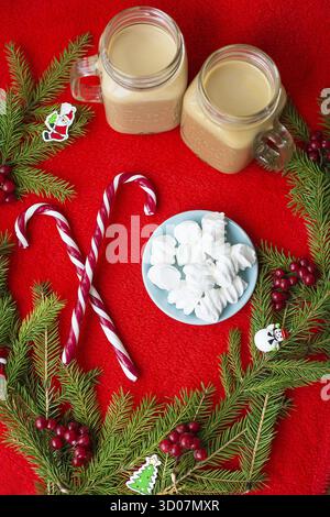 Christmas tree, candy, coffee marshmellou on a red background. Happy New Year Stock Photo