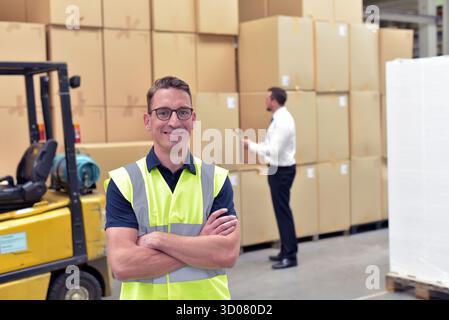 portrait Worker in a warehouse in the logistics sector - transport and processing of orders in trade Stock Photo