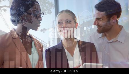 Three business professionals in business attire discussing strategy in office, with tablet device Stock Photo