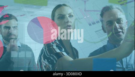 Presenting woman wearing striped blouse pointing at digital chart display in office with pie charts Stock Photo