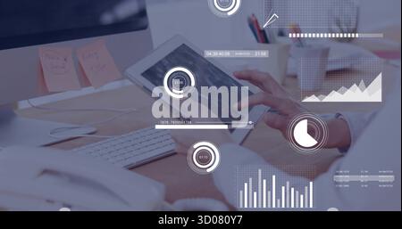 Tapping tablet woman in white blouse viewing AR data at office desk, with monitor, pens Stock Photo