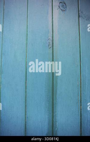 Shabby and very old green-blue wooden fence Stock Photo