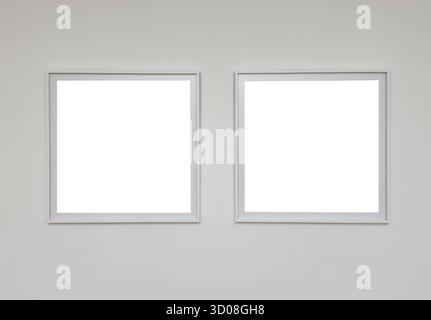 Square frames mockups, pair hangs on white wall. minimalist blank mockup template for modern interior art picture, simple stylish element for creative Stock Photo