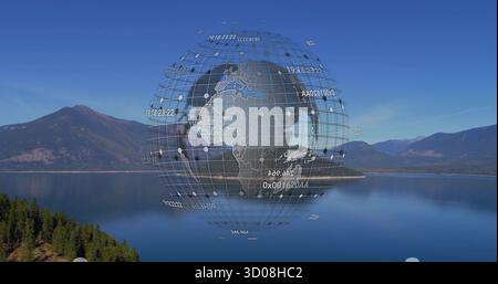 Hovering digital globe wireframe floating above lake in mountain valley, with numeric data labels Stock Photo