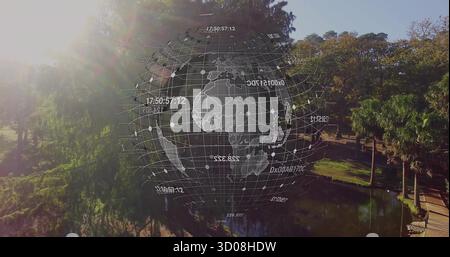 Displaying holographic globe overlaying pond and walkway in urban park, showing data points Stock Photo