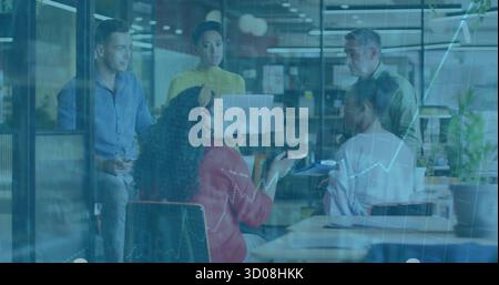 Collaborating five member team discussing financial data in office, with laptop tablet documents Stock Photo