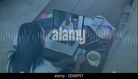 Taking notes graphic designer writing at home office desk, with laptop and color wheel, copy space Stock Photo