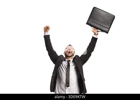 Man celebrating success holding a briefcase and looking up isolated on white background Stock Photo