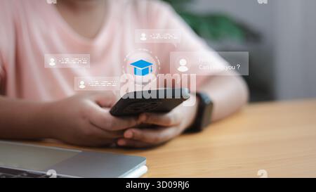 Student using AI chatbot for online learning on smartphone. Concept of virtual assistant, education technology, and digital communication in modern le Stock Photo