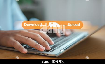 Hands typing on laptop with upload and download cloud data transfer concept. Modern technology, online storage, and digital network connection for bus Stock Photo