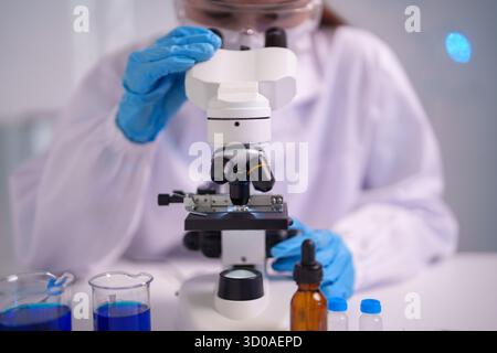 Dedicated adult scientist performs meticulous lab research investigating microscopic organisms Developing medical breakthroughs exploring biological i Stock Photo
