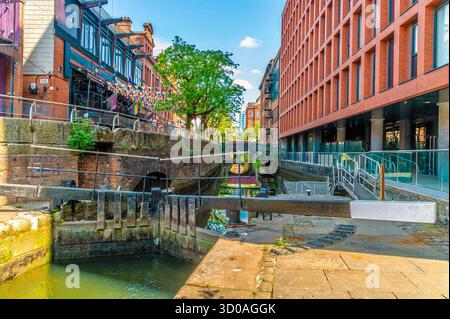 A view towards lock gates in canal street  in Manchester,UK in summertime Stock Photo