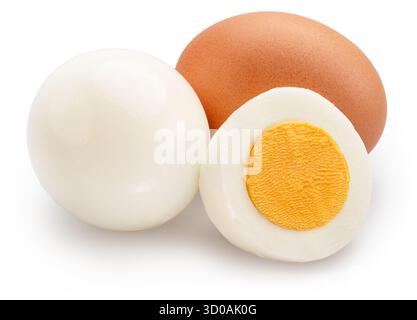 Hard-boiled chicken eggs and half of egg with yellow hard yolk on white background. File contains clipping path. Stock Photo