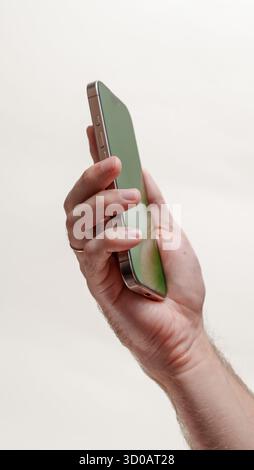Digital Template: Green Screen Smartphone in Hands Stock Photo