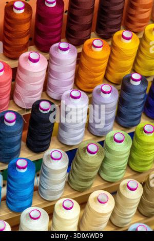 Colourful thread bobbins background Stock Photo