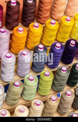 Colourful thread bobbins background Stock Photo