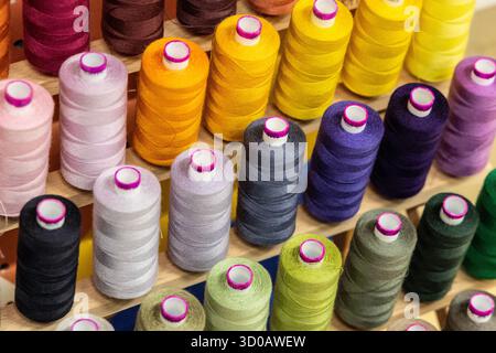 Colourful thread bobbins background Stock Photo