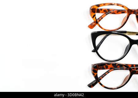 Front view of a selection of pretty wonen's glasses with isolated on a plain white background. Copy space. No people. Stock Photo