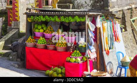 Market stall selling fruit with colorful produce stacked into artistic towers, showcasing a vibrant display of fresh tropical fruits. Stock Photo