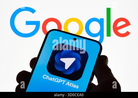 ChatGPT Atlas app against Google lettering shows competition with traditional search. Stafford, United Kingdom, October 22, 2025 Stock Photo
