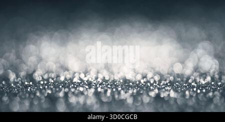Silver gray glitter texture background, an elegant macro shot as abstract frame with bokeh circles and copy space Stock Photo