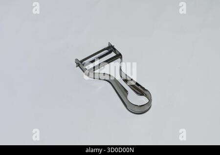Stainless Steel Vegetable Peeler With Curved Handle For Easy Kitchen Peeling and Prep Stock Photo